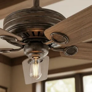 A rustic ceiling fan with dark wood blades and an oil-rubbed bronze finish, perfect for adding a touch of farmhouse charm to a living room.