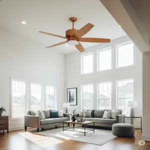A modern wooden ceiling fan with five blades installed in a bright living room, complementing the minimalist decor and providing comfortable airflow.