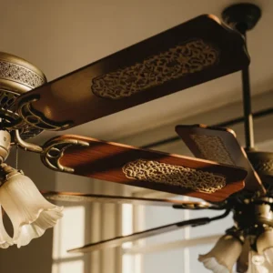 A close-up illustration of the varied blade designs found on antique ceiling fans, from ornate carved wood to simple metal, reflecting different eras.