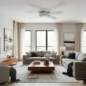 A modern white hugger ceiling fan installed flush against the ceiling in a bright living room, providing efficient air circulation and a sleek look.
