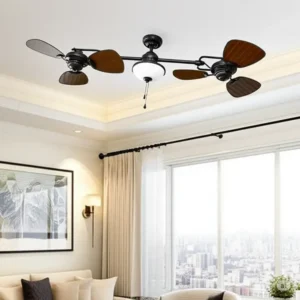 A linear dual ceiling fan in an oil-rubbed bronze finish with dark wood blades and a central light, shown in a contemporary living room.