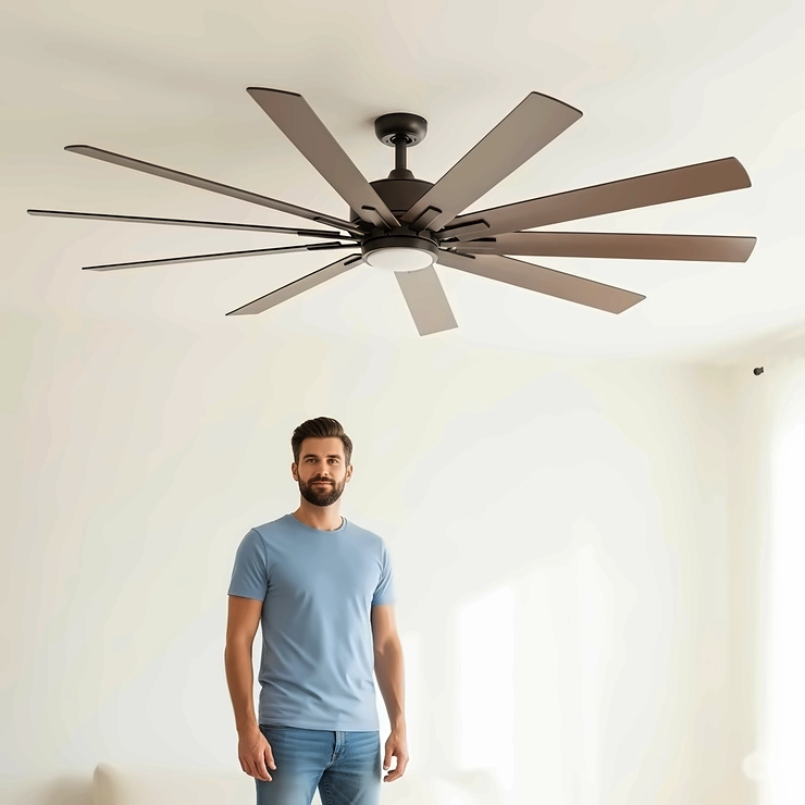 A person standing next to a large 8 ft ceiling fan, visually demonstrating its impressive size and coverage for big rooms.