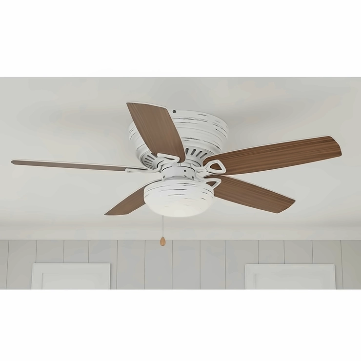 A low-profile farmhouse ceiling fan with a white distressed finish and reversible blades, ideal for rooms with lower ceilings while maintaining a charming rustic aesthetic.