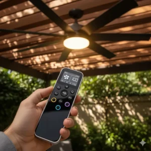 A user holding a remote control, which operates the speeds and light of an 84-inch outdoor ceiling fan.