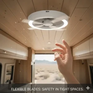 Close-up of transparent flexible blades on a compact camper ceiling fan to prevent injury in tight spaces.