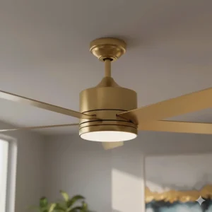 Close-up detail of the smooth, brushed gold finish on the metal motor housing of the ceiling fan.