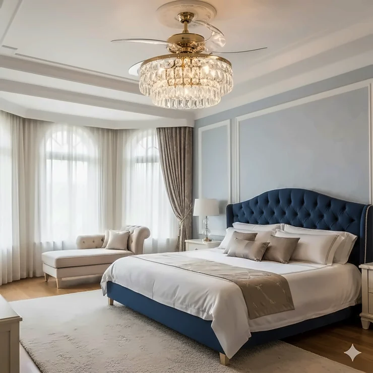 Elegant crystal ceiling fan chandelier with retractable blades installed in a modern master bedroom.