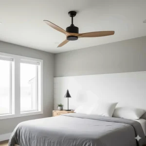 Sleek matte black modern farmhouse ceiling fan with three streamlined wooden blades, ideal for a contemporary bedroom.