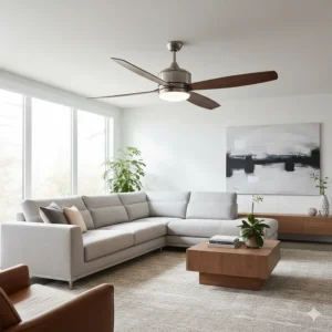A three blade ceiling fan with a modern brushed nickel finish and an integrated LED light kit, installed in a living room.
