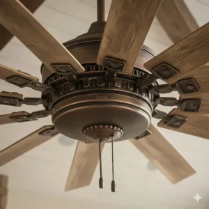 Close-up of the durable windmill ceiling fan motor housing, featuring an aged bronze finish.