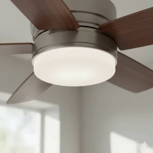 Detail of an integrated, energy-efficient LED light kit seamlessly attached to a wood ceiling fan motor housing.