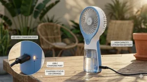 Close-up of a USB charging port on a handheld misting fan with a battery indicator light.