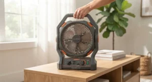 A lightweight battery powered box fan with an integrated carrying handle.