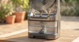 Close-up of a portable misting fan highlighting its built-in water tank and mist nozzles.