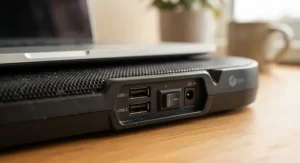 Close-up view of the dual USB ports and power switch on a quiet laptop cooling pad.