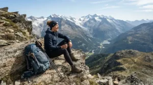A hiker wearing a blue evaporative cooling headband on a mountain trail