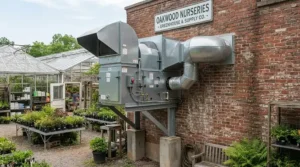 A greenhouse evaporative cooler providing effective swamp cooler ventilation for tropical plants